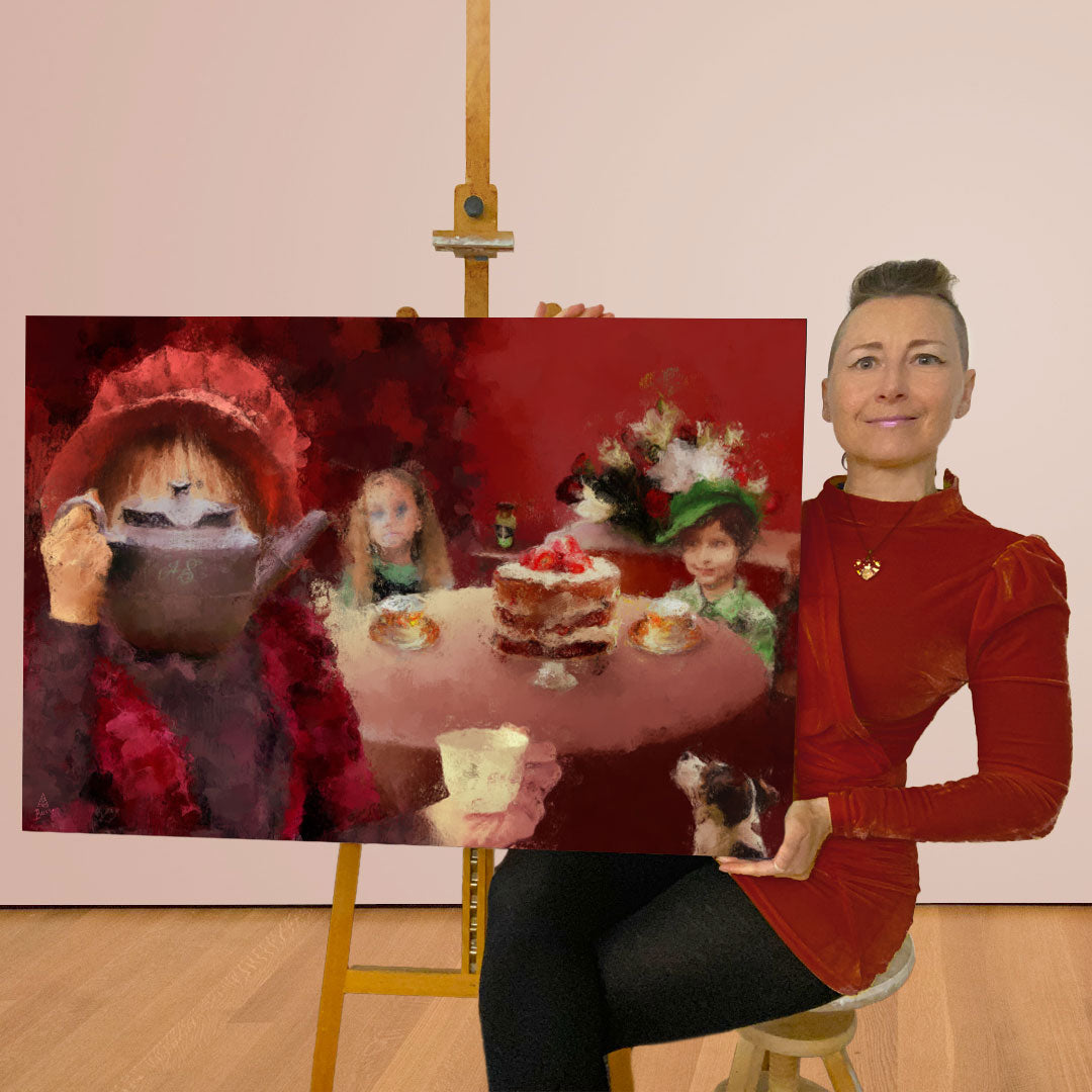 Anna-Marie Buss artist is holding a large canvas painting of a whimsical tea-time scene with children and a dog. The painting features a red background and soft painterly details but hidden beneath is a dark and sinister story.