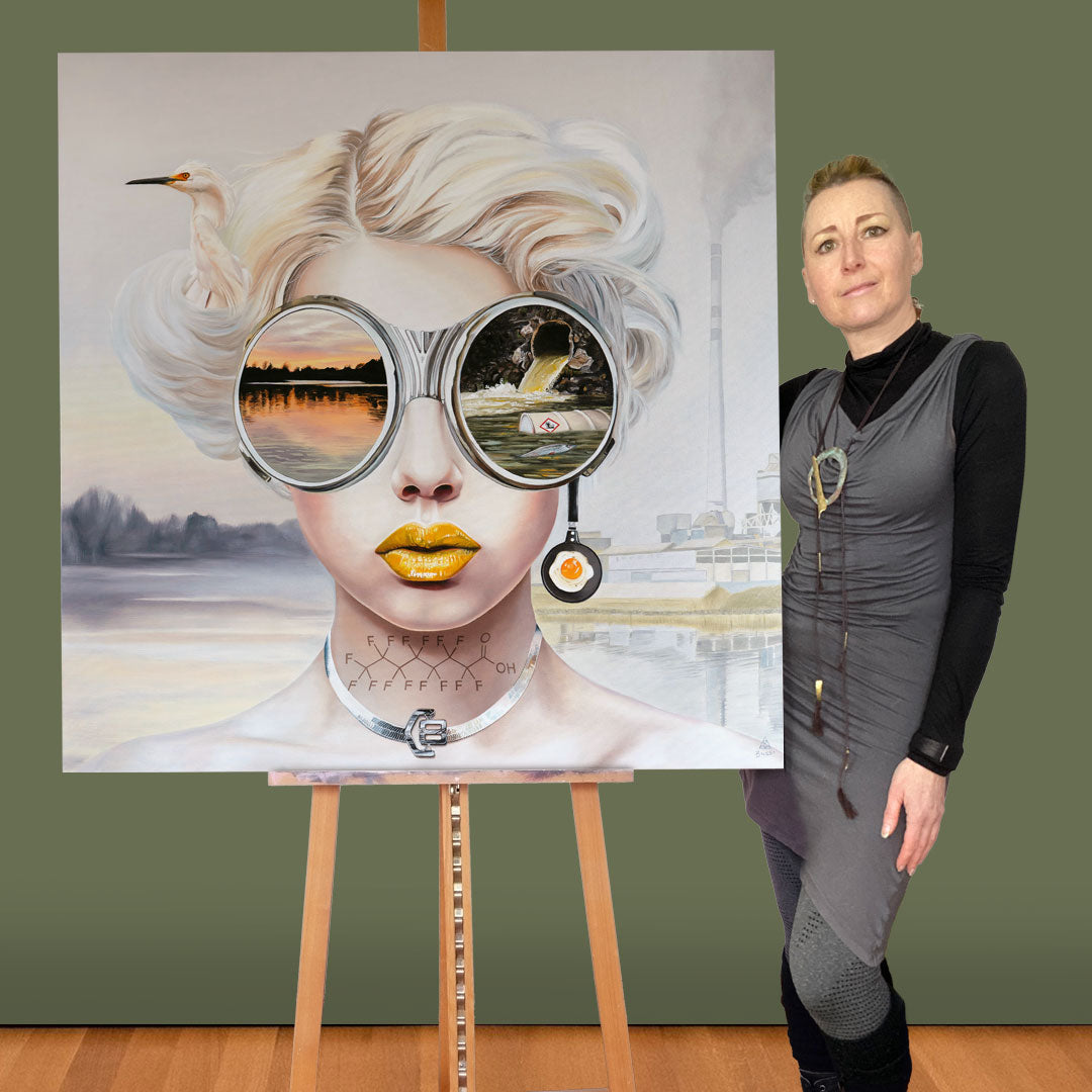 Anna-Marie Buss Artist standing next to Toxic Waste Painting